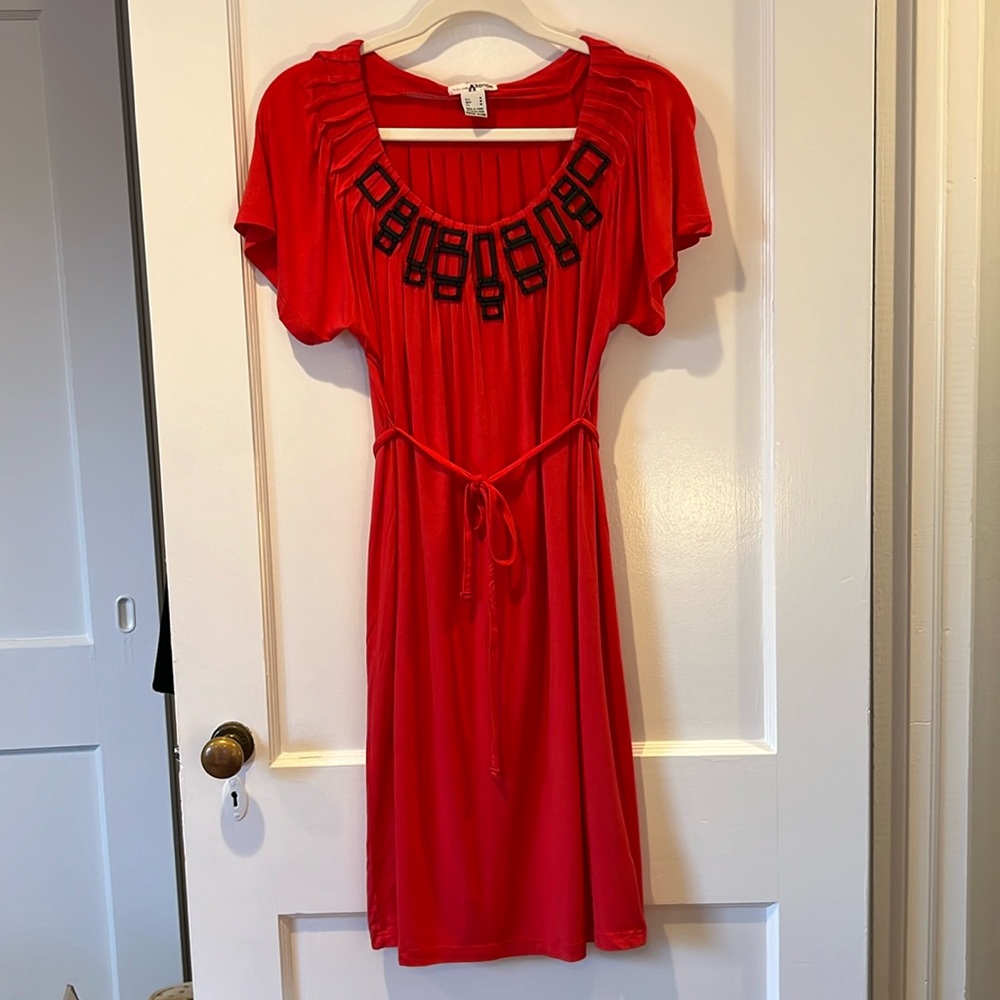 Kensie red dress with black detail at chest. Ties at waist.